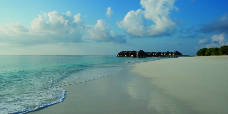 Water Villas of the JA Resort - Picturesque view from the beach to the water villass which are built above the sea.